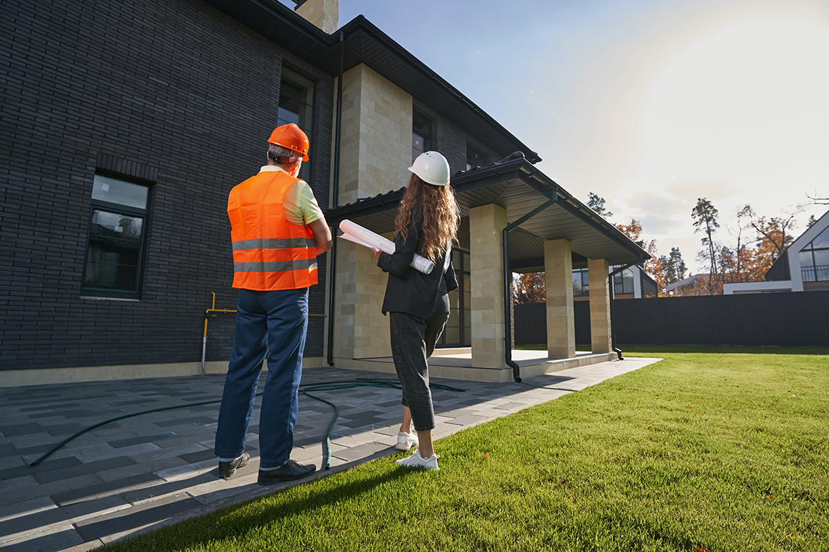 Inspect East inspector reviewing a Melbourne property exterior with equipment on hand