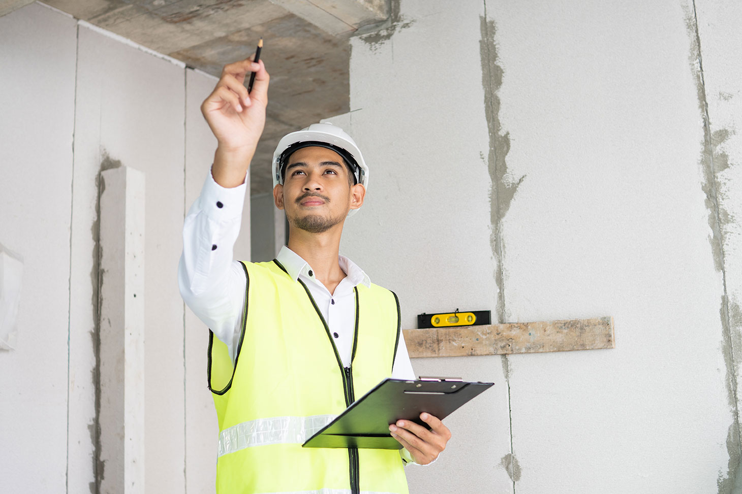Inspector reviewing a paper checklist on-site